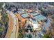 Aerial view of community amenities, including tennis courts, pool, and clubhouse at 905 Fairview Club Cir, Dacula, GA 30019