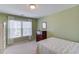 Charming bedroom with light green walls and a large window at 905 Fairview Club Cir, Dacula, GA 30019