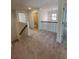 Upstairs hallway featuring plush carpeting, neutral walls, and a view of the stairway at 2280 Highridge Point Dr, Lithia Springs, GA 30122