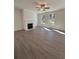 Bright and airy living room with modern fireplace, wood-look flooring, and natural light from windows at 2280 Highridge Point Dr, Lithia Springs, GA 30122