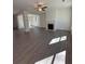 Spacious living room featuring wood-look flooring, a fireplace, and a ceiling fan at 2280 Highridge Point Dr, Lithia Springs, GA 30122