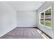 Bright bedroom with neutral walls and carpet at 4251 Matisse Ln, Fairburn, GA 30213