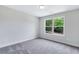 Simple bedroom with neutral walls and carpet at 4251 Matisse Ln, Fairburn, GA 30213