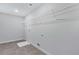 Laundry room with tile flooring and ample shelving at 4251 Matisse Ln, Fairburn, GA 30213