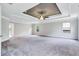 Main bedroom with tray ceiling, ceiling fan, and carpet at 4251 Matisse Ln, Fairburn, GA 30213