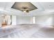 Main bedroom with tray ceiling, ceiling fan, and carpet at 4251 Matisse Ln, Fairburn, GA 30213