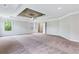 Large main bedroom with tray ceiling, ceiling fan, and carpet at 4251 Matisse Ln, Fairburn, GA 30213