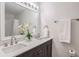 Bathroom with double vanity, quartz countertops and updated fixtures at 1302 Woodcliff Dr, Atlanta, GA 30350