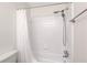 Clean bathroom with shower/tub combo and white tile at 1302 Woodcliff Dr, Atlanta, GA 30350