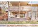 Back deck with covered patio and wooden railings at 1302 Woodcliff Dr, Atlanta, GA 30350