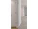 Hallway with neutral walls, carpet and doors to other rooms at 1302 Woodcliff Dr, Atlanta, GA 30350