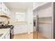 Kitchen with stainless steel appliances and white cabinetry at 1302 Woodcliff Dr, Atlanta, GA 30350