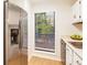 Stainless steel refrigerator and window overlooking the backyard at 1302 Woodcliff Dr, Atlanta, GA 30350