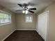 Simple bedroom with a ceiling fan, large closet, and hardwood floors at 2820 Arlington Rd, Atlanta, GA 30344