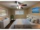 Bright bedroom with a ceiling fan, large window, and hardwood floors at 2820 Arlington Rd, Atlanta, GA 30344