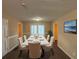 Elegant dining room with a large table, neutral walls, and hardwood floors at 2820 Arlington Rd, Atlanta, GA 30344