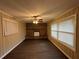 Bright living room with a brick fireplace and dark hardwood floors at 2820 Arlington Rd, Atlanta, GA 30344