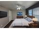 Main bedroom with a large bed, dresser, and wall-mounted TV at 2053 Juanita St, Decatur, GA 30032