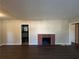 Living room with hardwood floors and a brick fireplace at 2053 Juanita St, Decatur, GA 30032