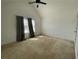 Bedroom with carpeted floors, vaulted ceiling, window, and grey curtains at 1251 Marlton Chase Dr, Lawrenceville, GA 30044