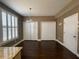 Spacious dining room featuring plantation shutters, dark wood floors and modern lighting at 1251 Marlton Chase Dr, Lawrenceville, GA 30044