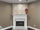 Close-up view of the stone fireplace featuring a marble hearth and white trim at 1251 Marlton Chase Dr, Lawrenceville, GA 30044