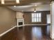 Spacious living room with fireplace, ceiling fan, and lots of natural light from the large windows at 1251 Marlton Chase Dr, Lawrenceville, GA 30044