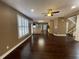 Hardwood floors leading into the kitchen with stainless steel appliances and a kitchen island at 1251 Marlton Chase Dr, Lawrenceville, GA 30044