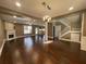 Living room view from entry showcasing fireplace and natural light from the windows and the staircase at 1251 Marlton Chase Dr, Lawrenceville, GA 30044