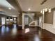 Open concept living room featuring hardwood floors and trim; note the fireplace in the back at 1251 Marlton Chase Dr, Lawrenceville, GA 30044