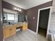 Main bathroom with double sinks, granite countertops, tile floor, and closet at 1251 Marlton Chase Dr, Lawrenceville, GA 30044