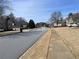 A street view of a quiet neighborhood with sidewalks at 1251 Marlton Chase Dr, Lawrenceville, GA 30044