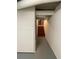 Hallway in unfinished basement, leading to a stairway and a door at 2071 Carthage Rd, Tucker, GA 30084