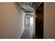 Basement hallway with painted concrete floors and neutral paint at 2071 Carthage Rd, Tucker, GA 30084