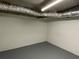 Unfinished basement area with white walls and exposed ceiling ductwork, ready for customization at 2071 Carthage Rd, Tucker, GA 30084