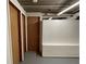 Unfinished basement area with storage and multiple doors at 2071 Carthage Rd, Tucker, GA 30084