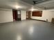Large unfinished basement area with multiple doors and concrete floor at 2071 Carthage Rd, Tucker, GA 30084