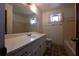 Bathroom with a large vanity, patterned floor, and a bathtub/shower combination with tiled walls at 2071 Carthage Rd, Tucker, GA 30084