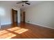 Bedroom featuring a ceiling fan, hardwood floors, neutral paint, and a closet at 2071 Carthage Rd, Tucker, GA 30084