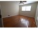 Bedroom featuring hardwood floors, neutral walls, ceiling fan, and windows for natural light at 2071 Carthage Rd, Tucker, GA 30084