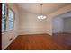 Bright dining room showcasing hardwood floors, a chandelier, and a large window at 2071 Carthage Rd, Tucker, GA 30084