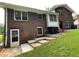 Back exterior with brick facade, multiple windows, and access to a spacious backyard at 2071 Carthage Rd, Tucker, GA 30084