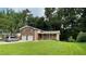 Charming two-story brick home featuring a well-manicured front lawn and a two-car garage at 2071 Carthage Rd, Tucker, GA 30084