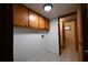 Laundry room with overhead cabinets and tile floors at 2071 Carthage Rd, Tucker, GA 30084