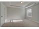 Well-lit bedroom featuring neutral walls, carpet, and a window with blinds at 4037 Andover Cir, Mcdonough, GA 30252