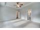 Main bedroom with carpet, door to bathroom, and ceiling fan at 4037 Andover Cir, Mcdonough, GA 30252