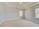 Bright bedroom with large window and neutral carpet at 4039 Andover Cir, Mcdonough, GA 30252