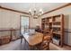 Traditional dining room featuring a wood table, chandelier, and classic décor at 9123 Thornton Blvd, Jonesboro, GA 30236