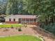 Brick ranch house with covered porch and landscaped yard at 9123 Thornton Blvd, Jonesboro, GA 30236