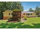 Ranch house with screened porch and landscaped yard at 9123 Thornton Blvd, Jonesboro, GA 30236